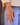 Billedet viser en Cuesta-ring i hvid og sølv. Ringen har et elegant og moderne design med en glat overflade og en subtil, skinnende finish.