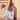 Billedet viser en lyserød totebag med teksten "Moonshine Rose". Tasken har et enkelt design og er velegnet til daglig brug.